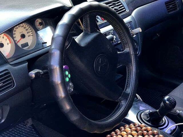 Синій Міцубісі Lancer, об'ємом двигуна 1.6 л та пробігом 248 тис. км за 4200 $, фото 7 на Automoto.ua