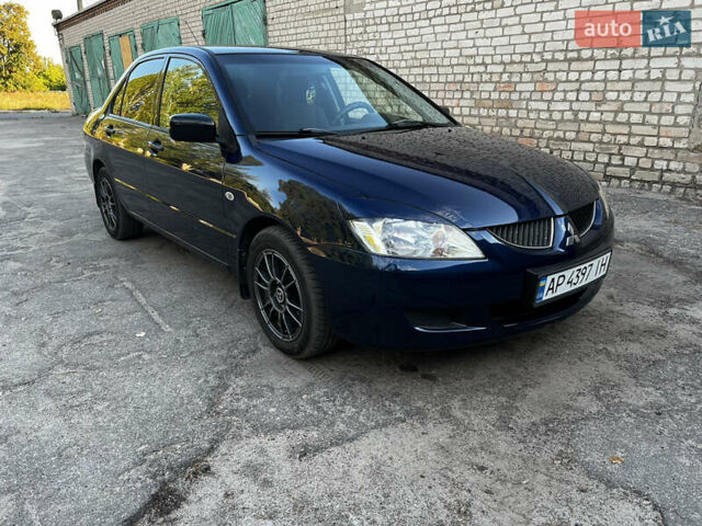 Синій Міцубісі Lancer, об'ємом двигуна 1.58 л та пробігом 324 тис. км за 4150 $, фото 8 на Automoto.ua