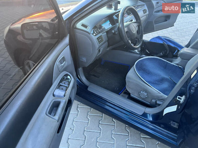 Синий Мицубиси Лансер, объемом двигателя 1.3 л и пробегом 290 тыс. км за 2999 $, фото 24 на Automoto.ua