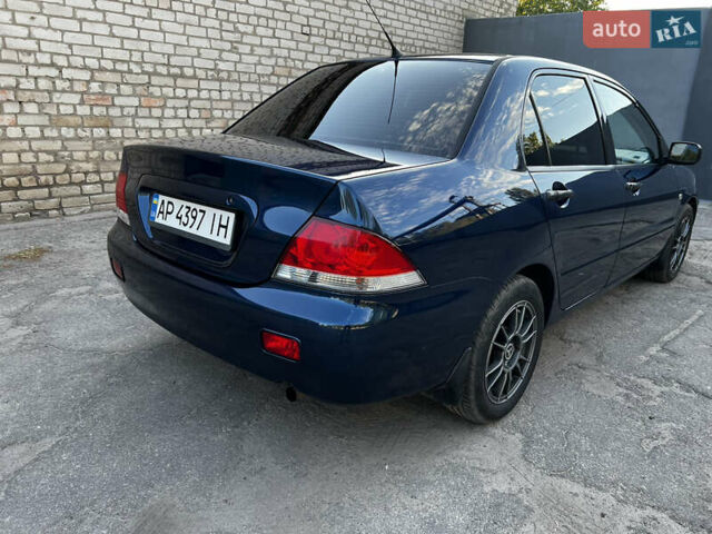 Синій Міцубісі Lancer, об'ємом двигуна 1.58 л та пробігом 324 тис. км за 4150 $, фото 5 на Automoto.ua