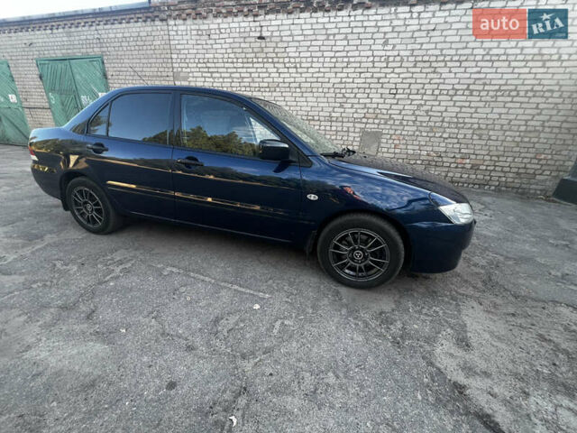 Синій Міцубісі Lancer, об'ємом двигуна 1.58 л та пробігом 324 тис. км за 4150 $, фото 7 на Automoto.ua