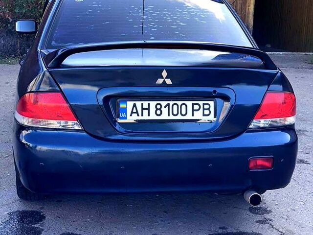 Синій Міцубісі Lancer, об'ємом двигуна 1.6 л та пробігом 248 тис. км за 4200 $, фото 2 на Automoto.ua