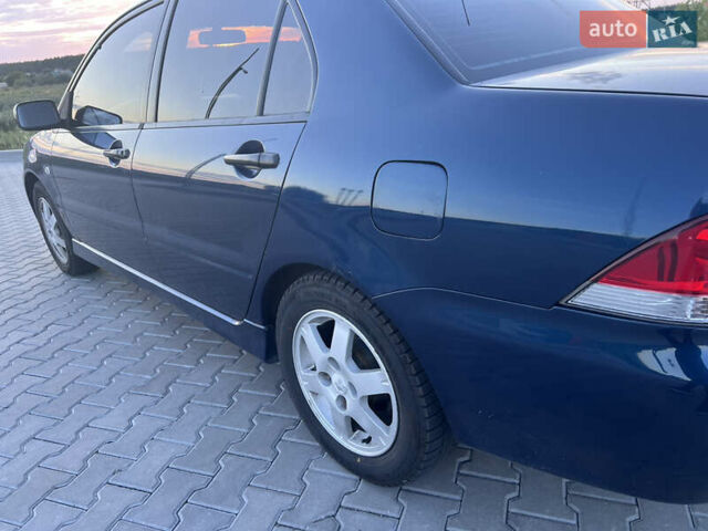 Синий Мицубиси Лансер, объемом двигателя 1.3 л и пробегом 290 тыс. км за 2999 $, фото 12 на Automoto.ua
