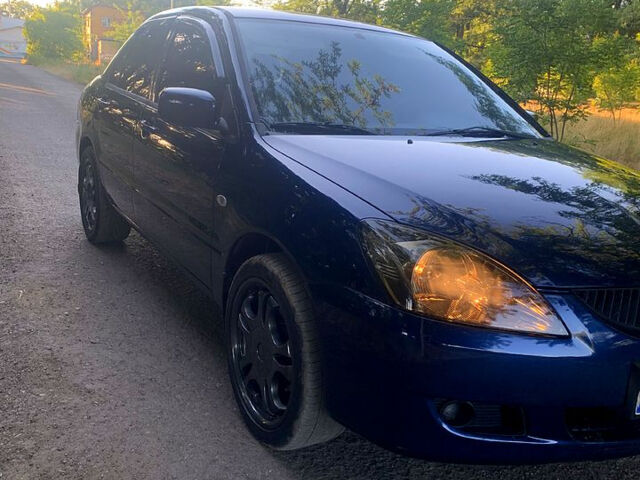 Синий Мицубиси Лансер, объемом двигателя 1.6 л и пробегом 295 тыс. км за 4550 $, фото 4 на Automoto.ua