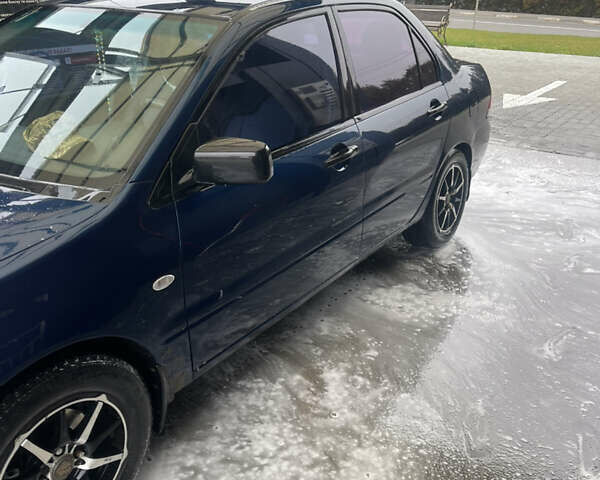 Синий Мицубиси Лансер, объемом двигателя 1.58 л и пробегом 234 тыс. км за 3500 $, фото 4 на Automoto.ua