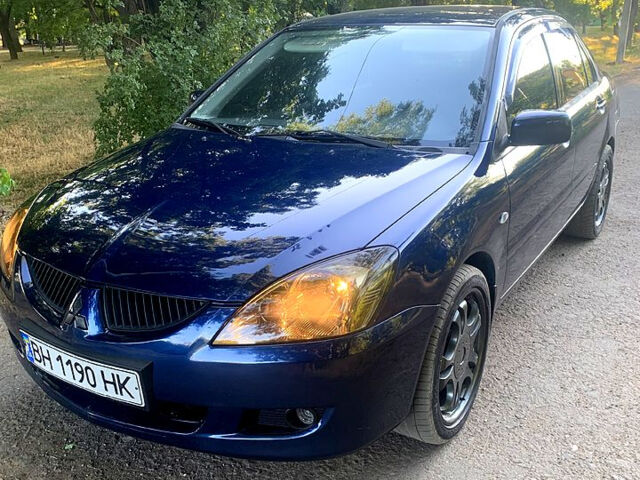 Синий Мицубиси Лансер, объемом двигателя 1.6 л и пробегом 295 тыс. км за 4550 $, фото 3 на Automoto.ua