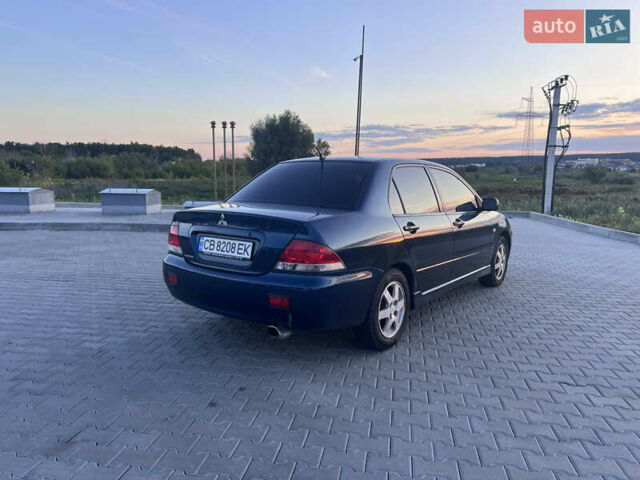 Синий Мицубиси Лансер, объемом двигателя 1.3 л и пробегом 290 тыс. км за 2999 $, фото 9 на Automoto.ua