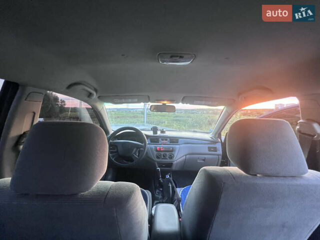 Синий Мицубиси Лансер, объемом двигателя 1.3 л и пробегом 290 тыс. км за 2999 $, фото 22 на Automoto.ua