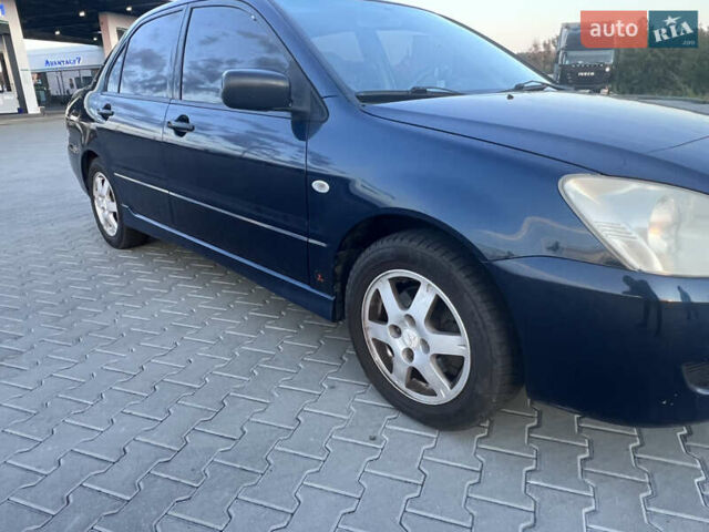 Синий Мицубиси Лансер, объемом двигателя 1.3 л и пробегом 290 тыс. км за 2999 $, фото 16 на Automoto.ua
