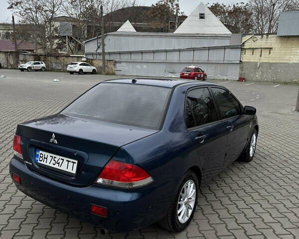 Синій Міцубісі Lancer, об'ємом двигуна 1.6 л та пробігом 200 тис. км за 5000 $, фото 5 на Automoto.ua