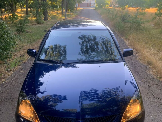 Синий Мицубиси Лансер, объемом двигателя 1.6 л и пробегом 295 тыс. км за 4550 $, фото 2 на Automoto.ua