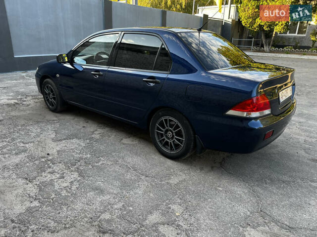 Синій Міцубісі Lancer, об'ємом двигуна 1.58 л та пробігом 324 тис. км за 4150 $, фото 2 на Automoto.ua