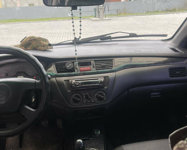 Синий Мицубиси Лансер, объемом двигателя 1.58 л и пробегом 234 тыс. км за 3500 $, фото 17 на Automoto.ua