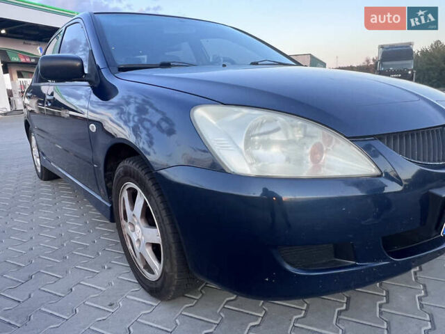 Синий Мицубиси Лансер, объемом двигателя 1.3 л и пробегом 290 тыс. км за 2999 $, фото 15 на Automoto.ua