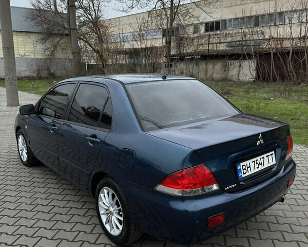 Синій Міцубісі Lancer, об'ємом двигуна 1.6 л та пробігом 200 тис. км за 5000 $, фото 4 на Automoto.ua