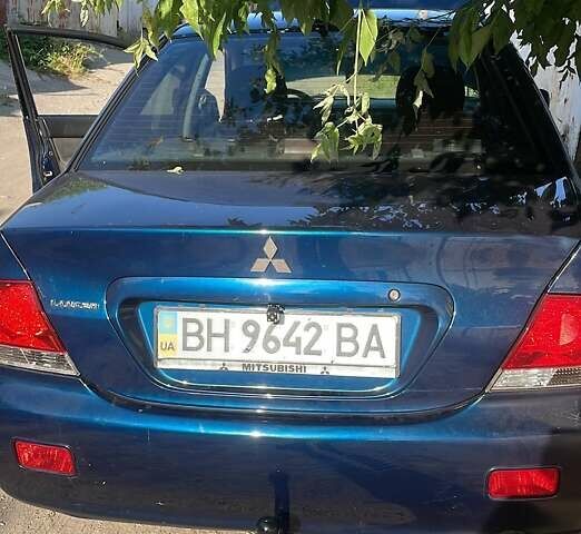 Синий Мицубиси Лансер, объемом двигателя 1.58 л и пробегом 386 тыс. км за 4200 $, фото 2 на Automoto.ua