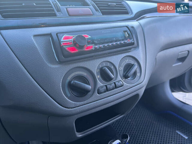 Синий Мицубиси Лансер, объемом двигателя 1.3 л и пробегом 290 тыс. км за 2999 $, фото 26 на Automoto.ua