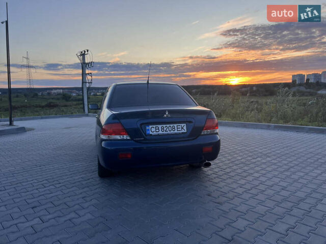 Синий Мицубиси Лансер, объемом двигателя 1.3 л и пробегом 290 тыс. км за 2999 $, фото 7 на Automoto.ua