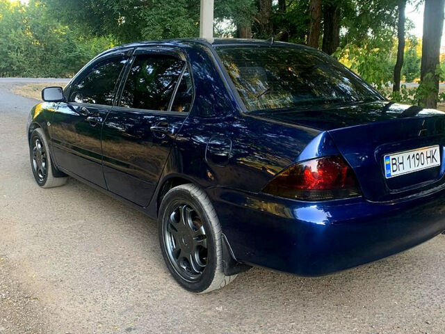 Синий Мицубиси Лансер, объемом двигателя 1.6 л и пробегом 295 тыс. км за 4550 $, фото 8 на Automoto.ua