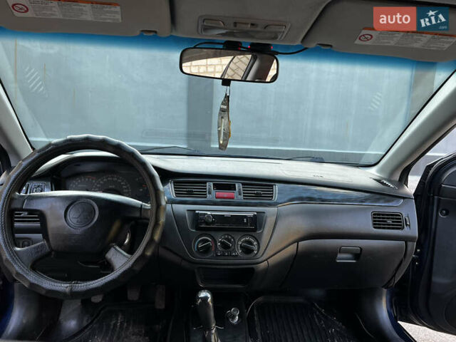 Синій Міцубісі Lancer, об'ємом двигуна 1.58 л та пробігом 324 тис. км за 4150 $, фото 12 на Automoto.ua