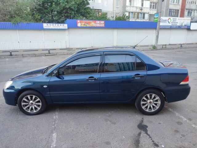 Синій Міцубісі Lancer, об'ємом двигуна 0.16 л та пробігом 257 тис. км за 3750 $, фото 9 на Automoto.ua