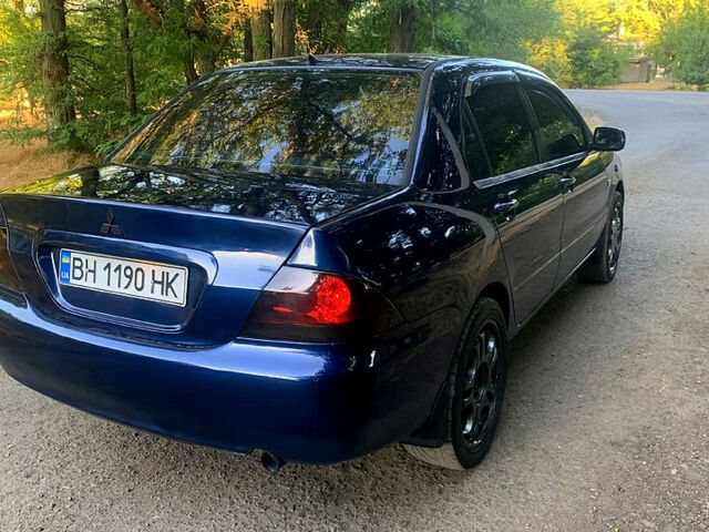 Синий Мицубиси Лансер, объемом двигателя 1.6 л и пробегом 295 тыс. км за 4550 $, фото 5 на Automoto.ua