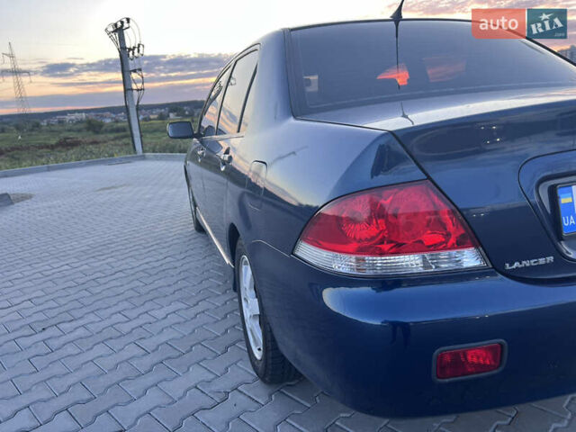Синий Мицубиси Лансер, объемом двигателя 1.3 л и пробегом 290 тыс. км за 2999 $, фото 11 на Automoto.ua