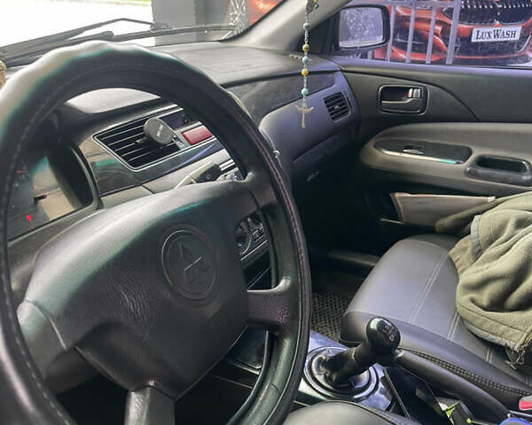 Синий Мицубиси Лансер, объемом двигателя 1.58 л и пробегом 234 тыс. км за 3500 $, фото 13 на Automoto.ua