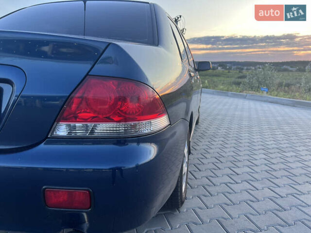 Синий Мицубиси Лансер, объемом двигателя 1.3 л и пробегом 290 тыс. км за 2999 $, фото 10 на Automoto.ua