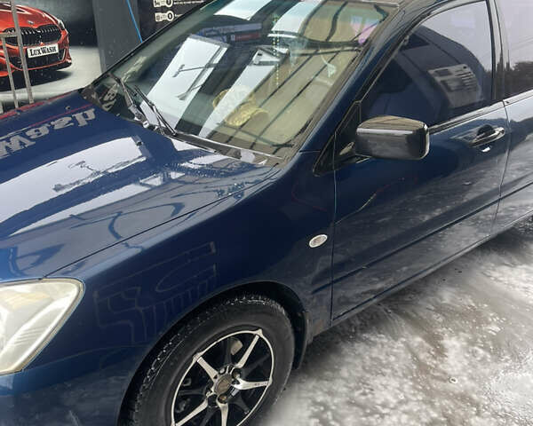 Синий Мицубиси Лансер, объемом двигателя 1.58 л и пробегом 234 тыс. км за 3500 $, фото 3 на Automoto.ua