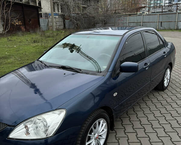Синій Міцубісі Lancer, об'ємом двигуна 1.6 л та пробігом 200 тис. км за 5000 $, фото 3 на Automoto.ua