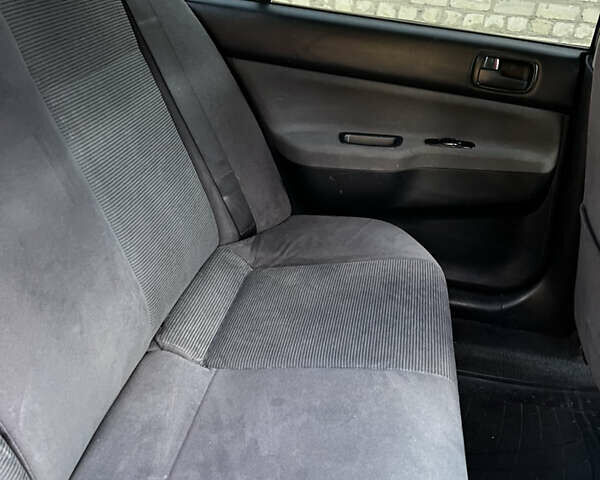 Синій Міцубісі Lancer, об'ємом двигуна 1.58 л та пробігом 324 тис. км за 4150 $, фото 20 на Automoto.ua