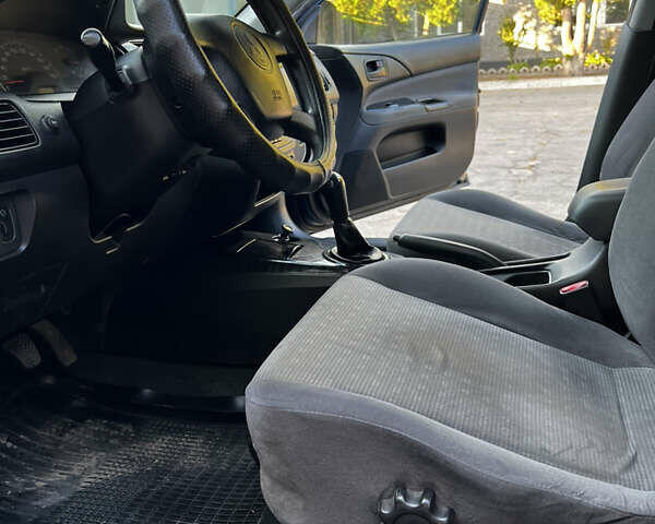 Синій Міцубісі Lancer, об'ємом двигуна 1.58 л та пробігом 324 тис. км за 4150 $, фото 10 на Automoto.ua
