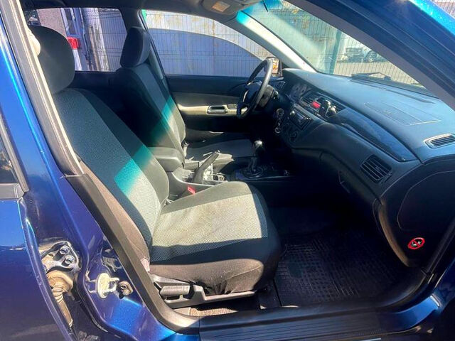 Синій Міцубісі Lancer, об'ємом двигуна 1.6 л та пробігом 239 тис. км за 3800 $, фото 7 на Automoto.ua
