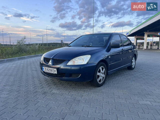 Синий Мицубиси Лансер, объемом двигателя 1.3 л и пробегом 290 тыс. км за 2999 $, фото 2 на Automoto.ua