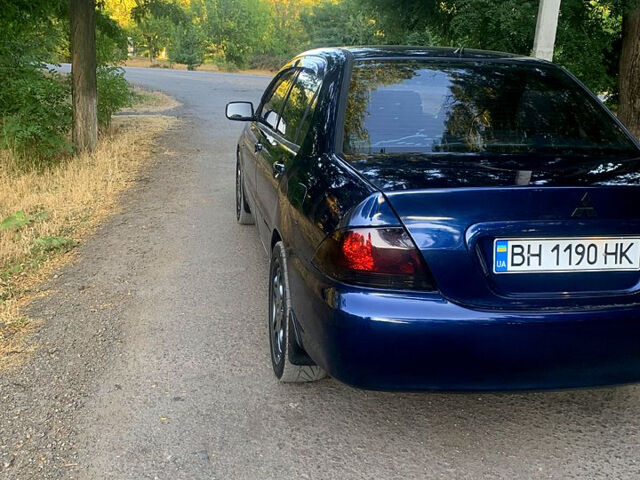 Синий Мицубиси Лансер, объемом двигателя 1.6 л и пробегом 295 тыс. км за 4550 $, фото 7 на Automoto.ua