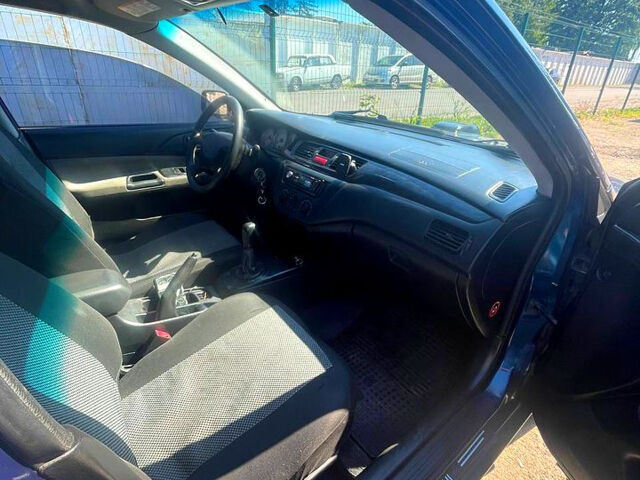 Синій Міцубісі Lancer, об'ємом двигуна 1.6 л та пробігом 239 тис. км за 3800 $, фото 9 на Automoto.ua