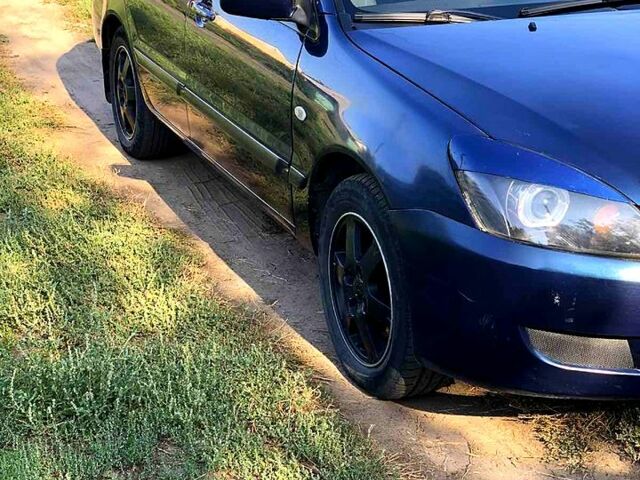 Синій Міцубісі Lancer, об'ємом двигуна 1.6 л та пробігом 248 тис. км за 4200 $, фото 10 на Automoto.ua