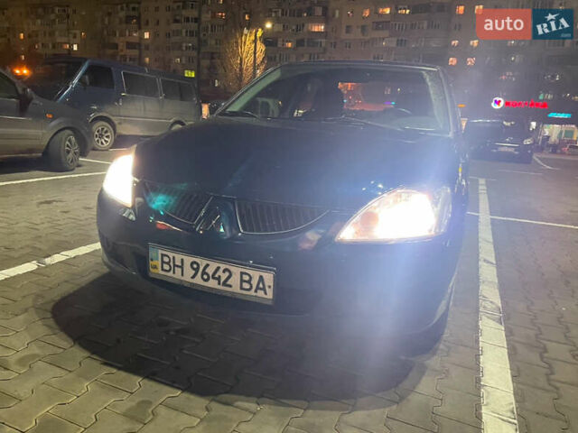 Синий Мицубиси Лансер, объемом двигателя 1.58 л и пробегом 386 тыс. км за 4200 $, фото 1 на Automoto.ua