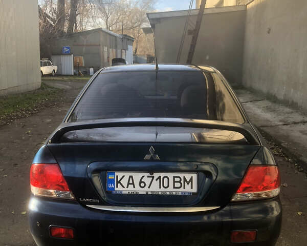 Синій Міцубісі Lancer, об'ємом двигуна 1.58 л та пробігом 346 тис. км за 4500 $, фото 2 на Automoto.ua