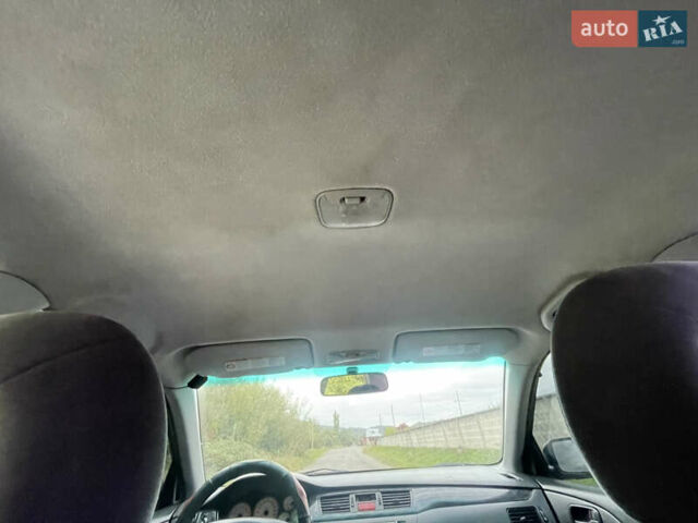 Синий Мицубиси Лансер, объемом двигателя 1.58 л и пробегом 250 тыс. км за 2750 $, фото 9 на Automoto.ua