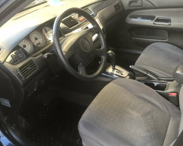 Синій Міцубісі Lancer, об'ємом двигуна 1.58 л та пробігом 346 тис. км за 4500 $, фото 9 на Automoto.ua
