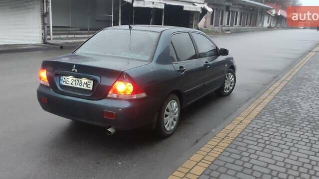 Синий Мицубиси Лансер, объемом двигателя 1.58 л и пробегом 358 тыс. км за 3500 $, фото 1 на Automoto.ua