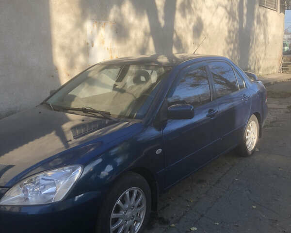 Синій Міцубісі Lancer, об'ємом двигуна 1.58 л та пробігом 346 тис. км за 4500 $, фото 1 на Automoto.ua
