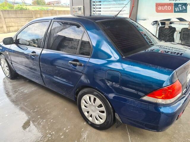 Синій Міцубісі Lancer, об'ємом двигуна 1.58 л та пробігом 330 тис. км за 3200 $, фото 1 на Automoto.ua