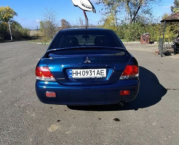 Синій Міцубісі Lancer, об'ємом двигуна 1.6 л та пробігом 267 тис. км за 3700 $, фото 5 на Automoto.ua