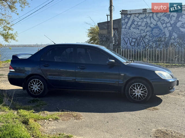 Синій Міцубісі Lancer, об'ємом двигуна 1.58 л та пробігом 269 тис. км за 3350 $, фото 3 на Automoto.ua