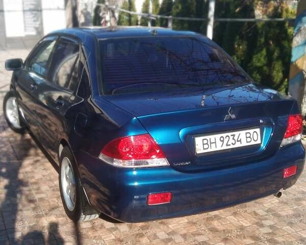 Синий Мицубиси Лансер, объемом двигателя 1.58 л и пробегом 195 тыс. км за 3990 $, фото 4 на Automoto.ua