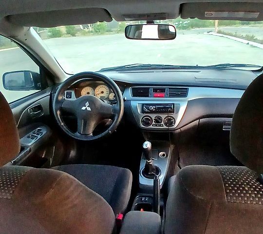 Синій Міцубісі Lancer, об'ємом двигуна 1.6 л та пробігом 0 тис. км за 3500 $, фото 6 на Automoto.ua