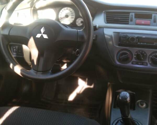 Синий Мицубиси Лансер, объемом двигателя 1.58 л и пробегом 195 тыс. км за 3990 $, фото 20 на Automoto.ua